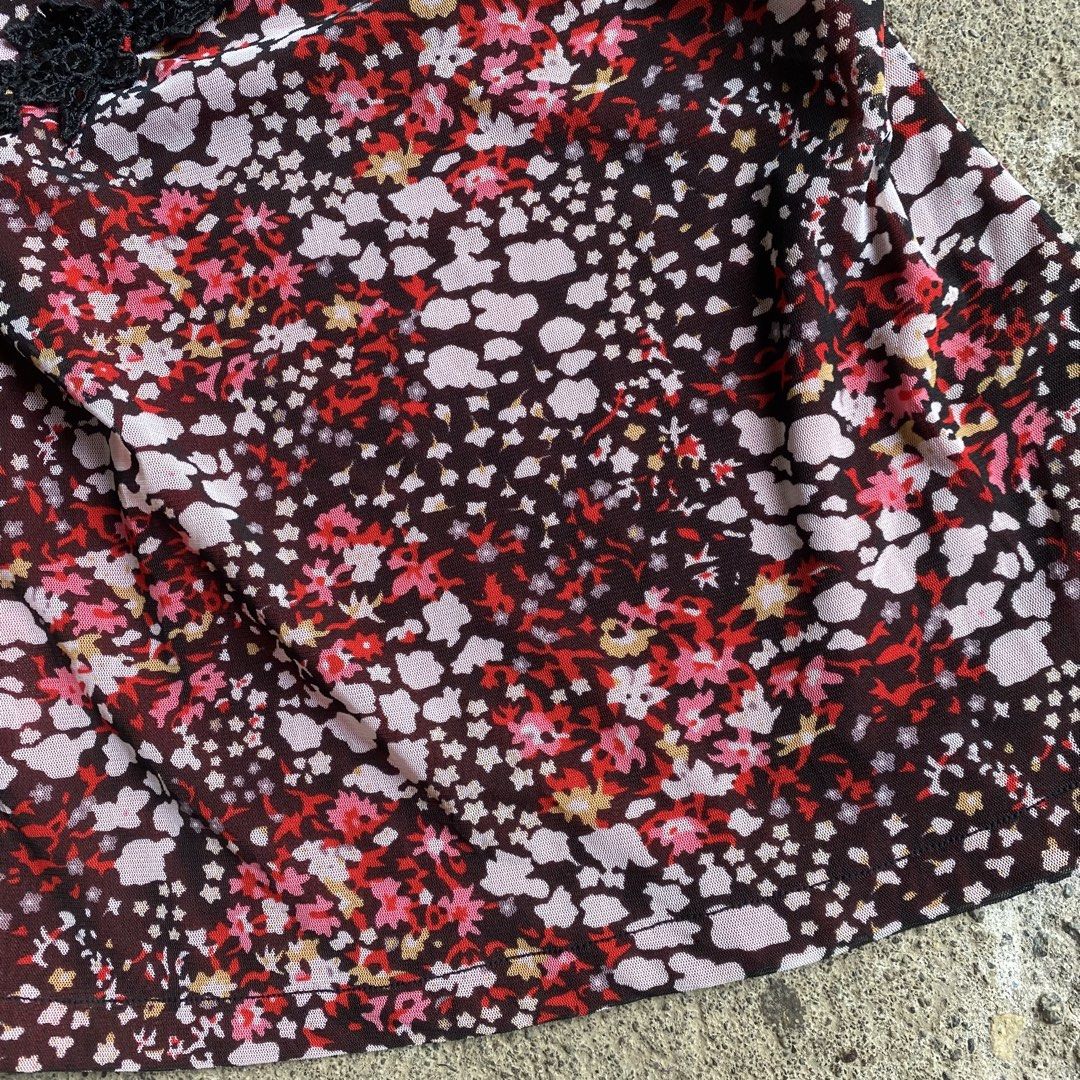 Goth Vampire Floral Mesh Blouse with Lace (Category: Blouses) located in Davao. Submitted by calli_2219 (Listing ID 1467188334, Image 3). Description: - Brand: NEO Sincere Fashion - Design: Dark base with pink and white floral print - Neckline: Square neck with black lace trim and subtle sequin accents - Sleeves: Short puff sleeves - Details: Red inner lining at the chest and black lace trim at the empire waist with gathered bust - Fit: Lightweig