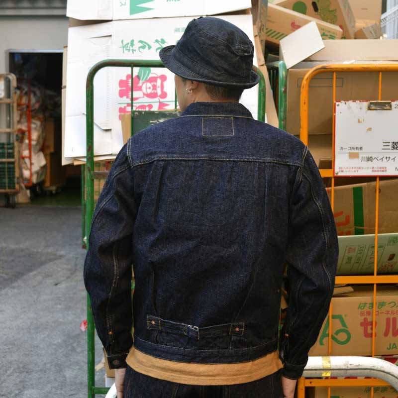 GraphZero 16oz Right Hand Twill Selvedge Denim Jacket (Category: Coats, Jackets and Outerwear) located in Manila. Submitted by limsanity03 (Listing ID 1467252297, Image 3). Description: - Brand: Graph Zero - Material: 16oz heavy texture right hand twill raw denim - Color: Deep indigo shade - Details: Single chest pocket with orange tab, pleated front, and cinch back buckle strap - Condition: Brand new with original store tag attached - Origin: Pr
