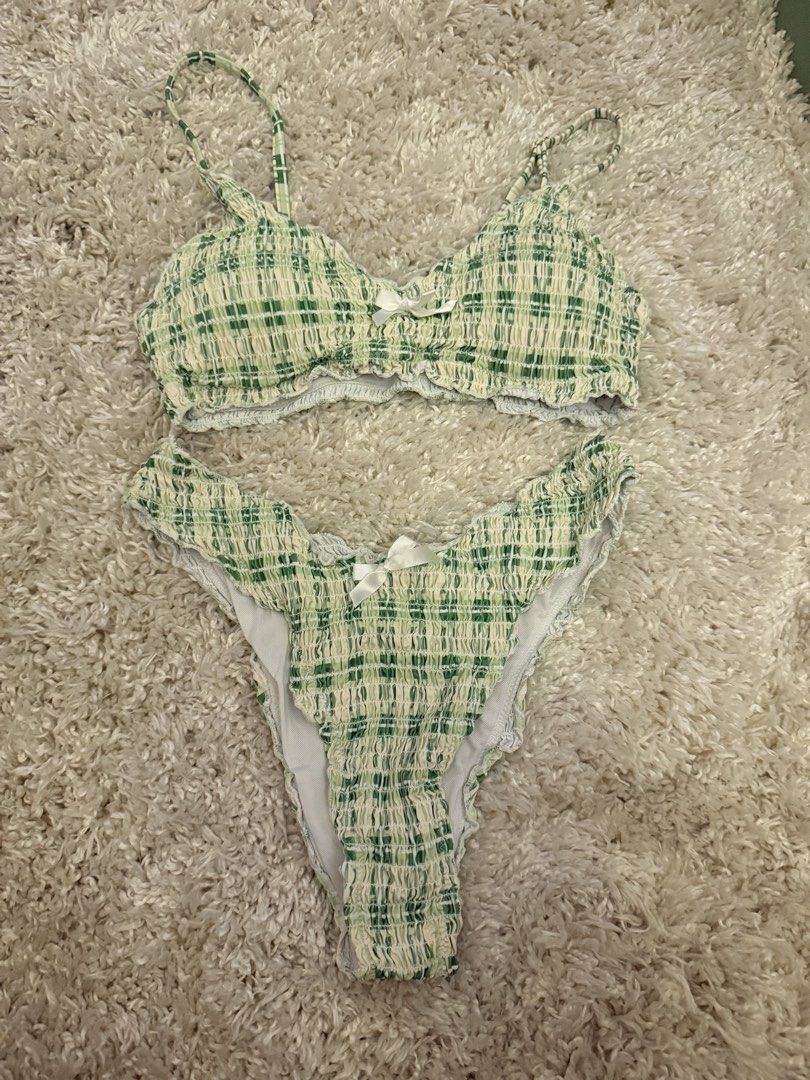 Green Plaid Smocked Bikini Set with White Bows (Category: Bikinis & Swimsuits) located in Mandaluyong City. Submitted by riz_040521 (Listing ID 1467207881, Image 1). Description: Worn once!! - Style: Green and white plaid two-piece swimsuit - Material: Super stretchy smocked fabric, fully lined - Top: Thin straps with a centered white bow - Bottoms: High-cut legs, cheeky coverage, and matching white bow - Fit & Use: Comfortable fit, perfect for b