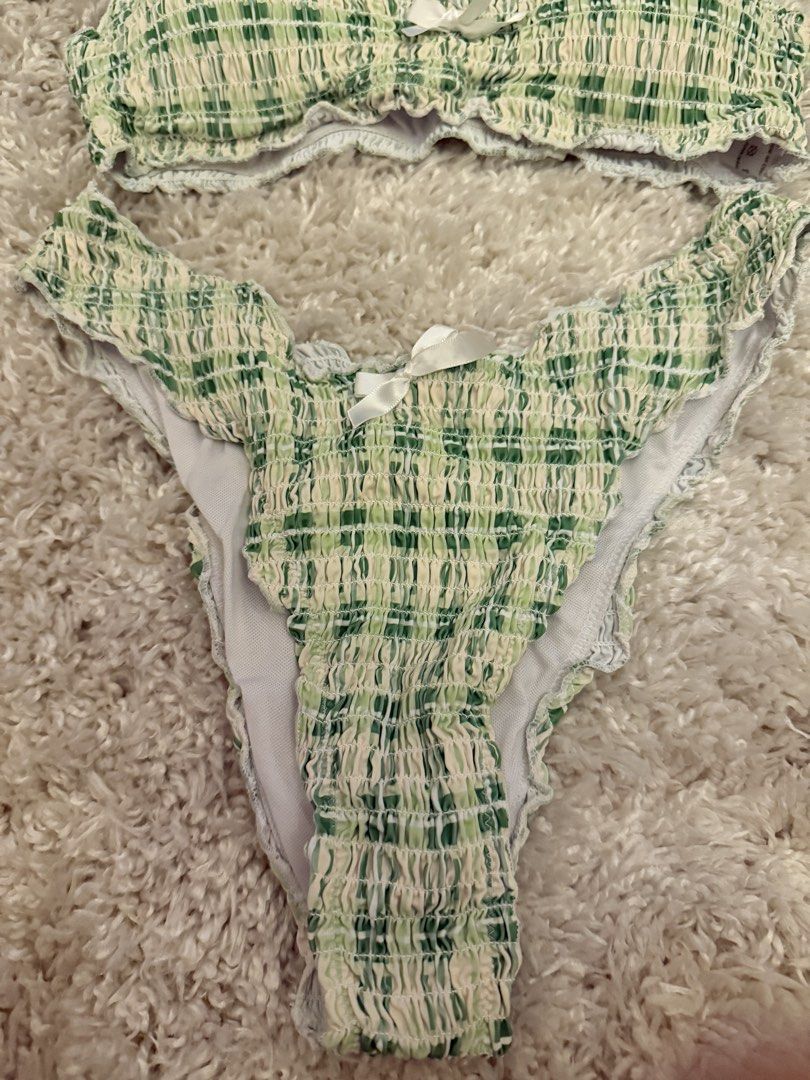 Green Plaid Smocked Bikini Set with White Bows (Category: Bikinis & Swimsuits) located in Mandaluyong City. Submitted by riz_040521 (Listing ID 1467207881, Image 3). Description: Worn once!! - Style: Green and white plaid two-piece swimsuit - Material: Super stretchy smocked fabric, fully lined - Top: Thin straps with a centered white bow - Bottoms: High-cut legs, cheeky coverage, and matching white bow - Fit & Use: Comfortable fit, perfect for b