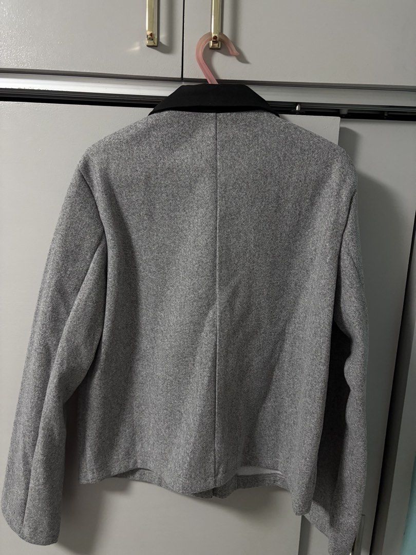 Grey Button-Up Jacket with Black Collar (Category: Coats, Jackets and Outerwear) located in Imus. Submitted by _monicakes (Listing ID 1467168978, Image 3). Description: - Color: Grey with contrasting black lapel collar - Design: Button-up front with dark buttons and front pockets - Fit: Structured look with a plain back - Feature: Perfect layering piece for cooler weather - Condition: Excellent.
