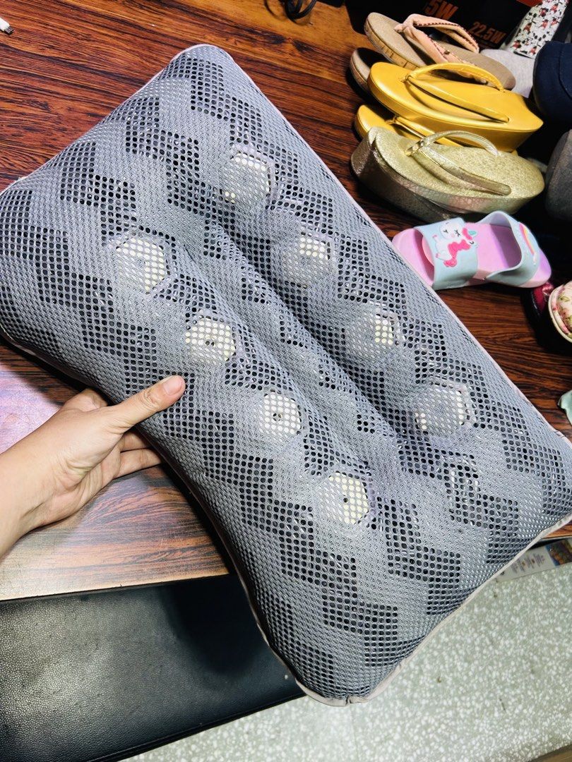 Grey Mesh Neck Massage Pillow With Rolling Balls (Category: Massage Devices) located in Manila. Submitted by starbalesukandjapansurplus (Listing ID 1467252158, Image 1). Description: - Grey mesh massage pillow with internal rolling nodes - Ideal for relieving neck and shoulder tension at home or in the office - Breathable fabric cover stays cool during extended use - Standard rectangular size for easy positioning - Clean condition and fully funct