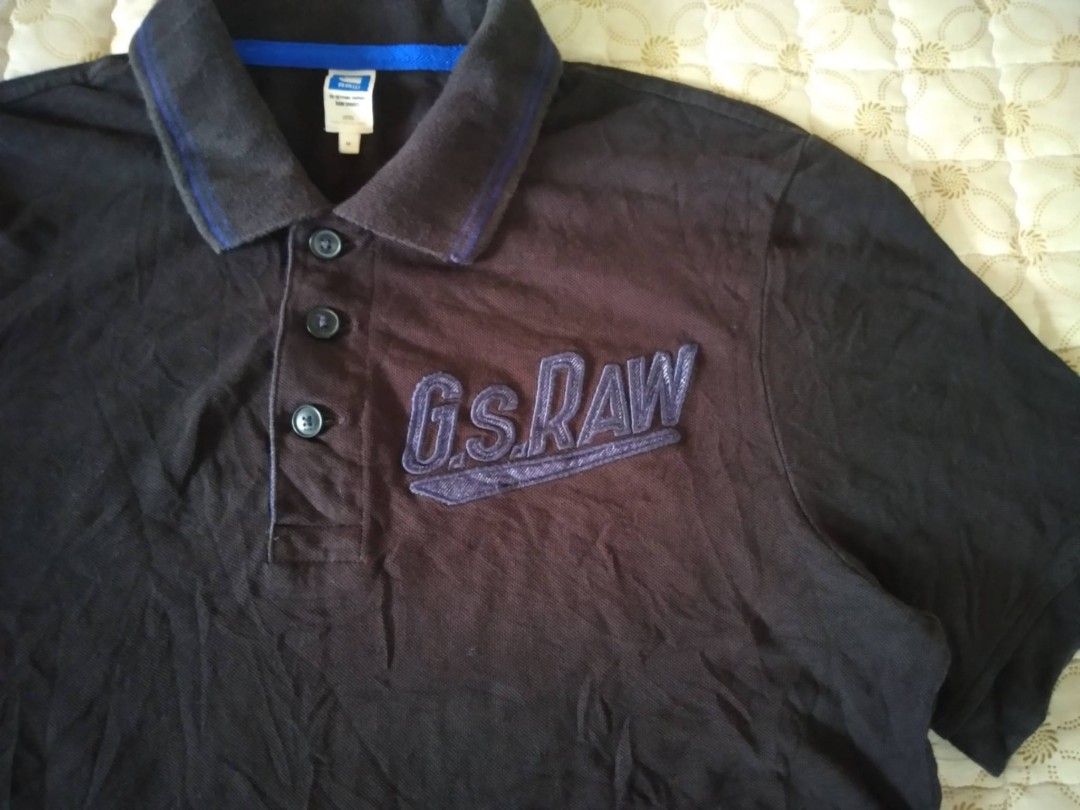 G-Star Raw Polo Shirt Dark Blue Medium (Category: Tshirts & Polo Shirts ) located in Zamboanga. Submitted by nurbya898048 (Listing ID 1467252096, Image 2). Description: G-Star Raw Raw Sports polo shirt in black. Size medium. Large embroidered G.S. Raw logo on the chest. Classic collar with three-button placket and contrasting blue inner taping. Small branded tag on the sleeve hem. RN 104506, CA 41169. Comfortable cotton knit material, great casua