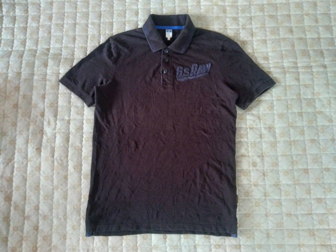 G-Star Raw Polo Shirt Dark Blue Medium (Category: Tshirts & Polo Shirts ) located in Zamboanga. Submitted by nurbya898048 (Listing ID 1467252096, Image 1). Description: G-Star Raw Raw Sports polo shirt in black. Size medium. Large embroidered G.S. Raw logo on the chest. Classic collar with three-button placket and contrasting blue inner taping. Small branded tag on the sleeve hem. RN 104506, CA 41169. Comfortable cotton knit material, great casua