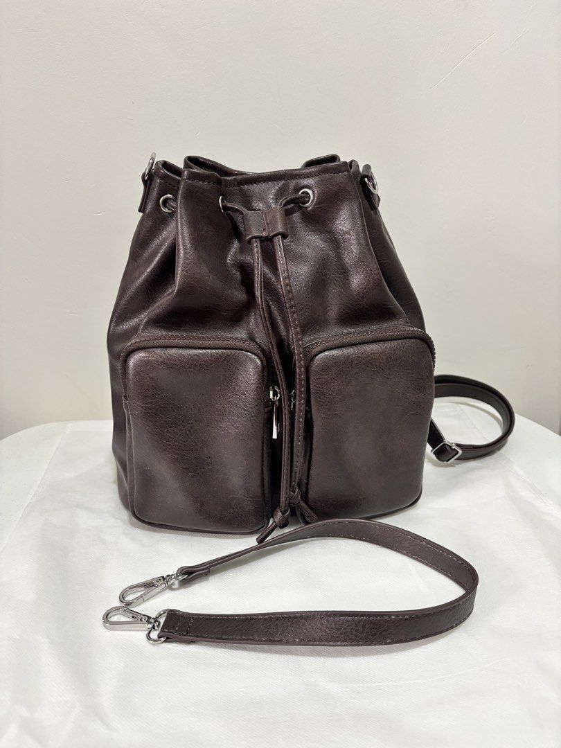 GU Pocket Mini Backpack - Dark Brown (Category: Backpacks) located in Taguig. Submitted by yumi9121 (Listing ID 1467361951, Image 1). Description: Like new! 10/10 condition RFS: Rarely used - Original GU bag (from Japan) - Dark brown PU leather convertible bag - Can be worn as a backpack or shoulder bag with the adjustable strap - Secure drawstring and magnetic lock closure - Two front zippered pockets for easy organization - Silver-tone hardware