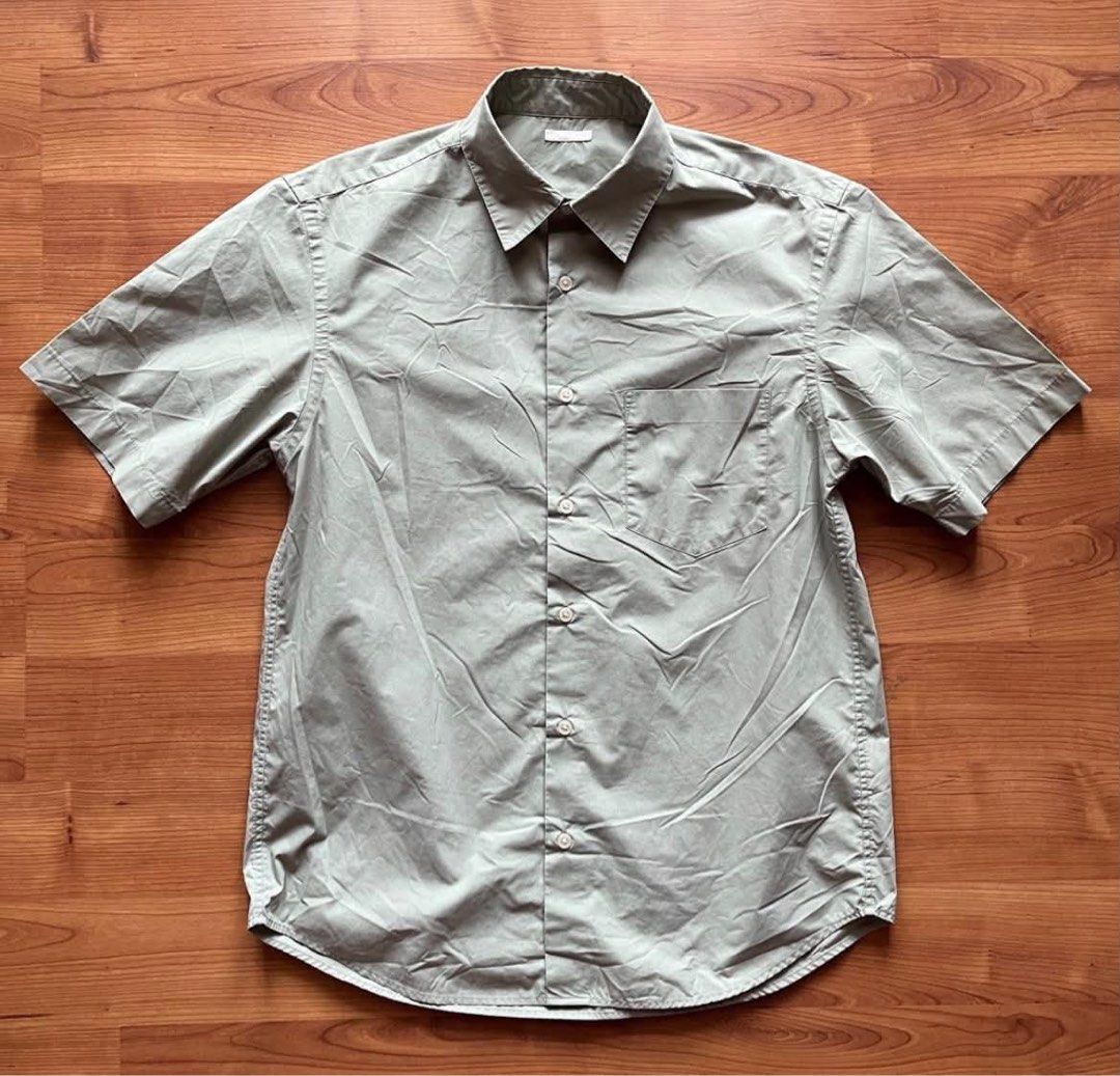 GU polo shirt (Category: Tshirts & Polo Shirts ) located in Rizal. Submitted by timelessfinds89_ (Listing ID 1467318532, Image 1). Description: - Color: Sage green - Size: Small (S) - Material: Lightweight cotton-blend - Design: Classic collar, front button placket, matching buttons - Details: Single left chest pocket, curved hemline - Fit: Versatile for both tucked and untucked looks - Condition: Clean piece, neutral tone that goes with everythi