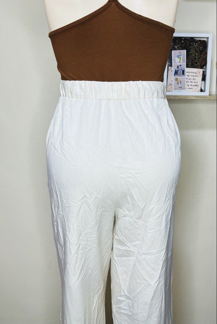 GU White Drawstring Wide Leg Pants Size XL (Category: Other Bottoms) located in Manila. Submitted by bengirlclothing (Listing ID 1467176212, Image 3). Description: - Brand: GU - Size: 28-32 inches -Length: 40 inches - Color: White - Style: Wide leg, straight cut - Waist: Elastic waistband with drawstring front .
