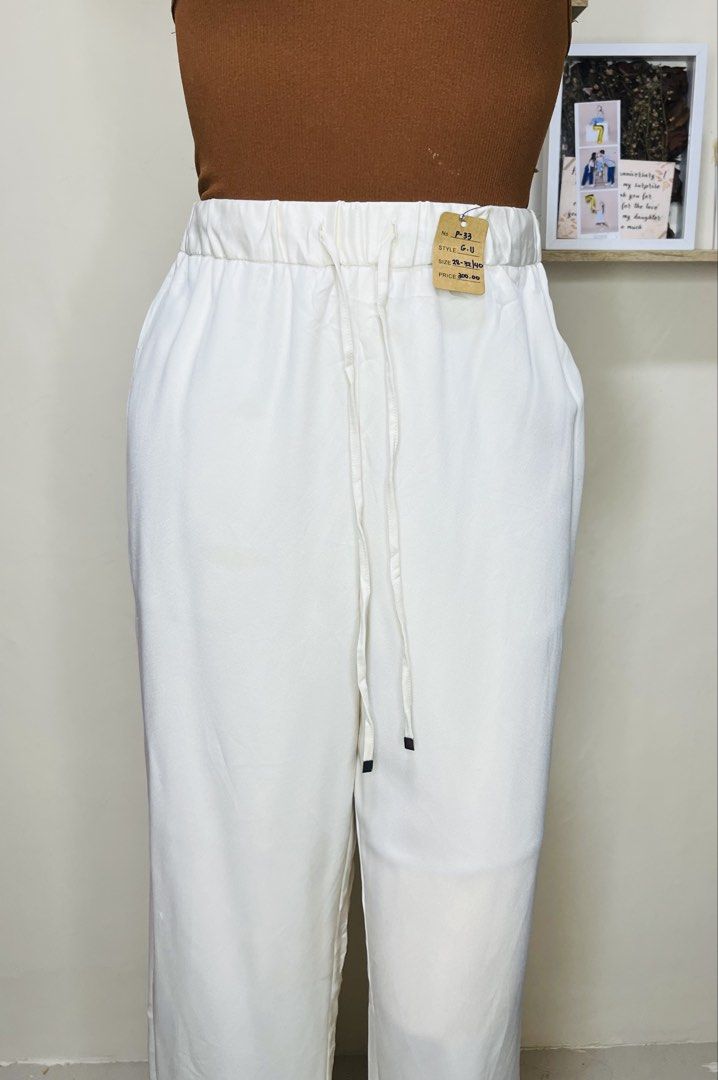 GU White Drawstring Wide Leg Pants Size XL (Category: Other Bottoms) located in Manila. Submitted by bengirlclothing (Listing ID 1467176212, Image 2). Description: - Brand: GU - Size: 28-32 inches -Length: 40 inches - Color: White - Style: Wide leg, straight cut - Waist: Elastic waistband with drawstring front .