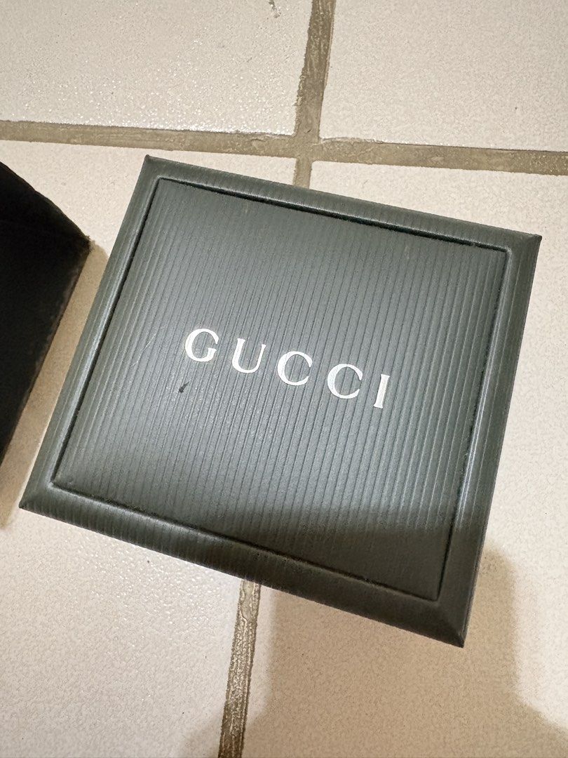 Gucci 1500L watch silver black dial (Category: Luxury Watches) located in Calamba. Submitted by angelliramosss (Listing ID 1467327288, Image 3). Description: - 100% Authentic Gucci rectangular watch - Chic minimalist design with a sleek black face/dial - Elegant silver-tone bangle strap - Includes original dark green Gucci box, interior branding, and watch pillow - Perfect accessory for daily wear or formal occasions Bought in Japan.