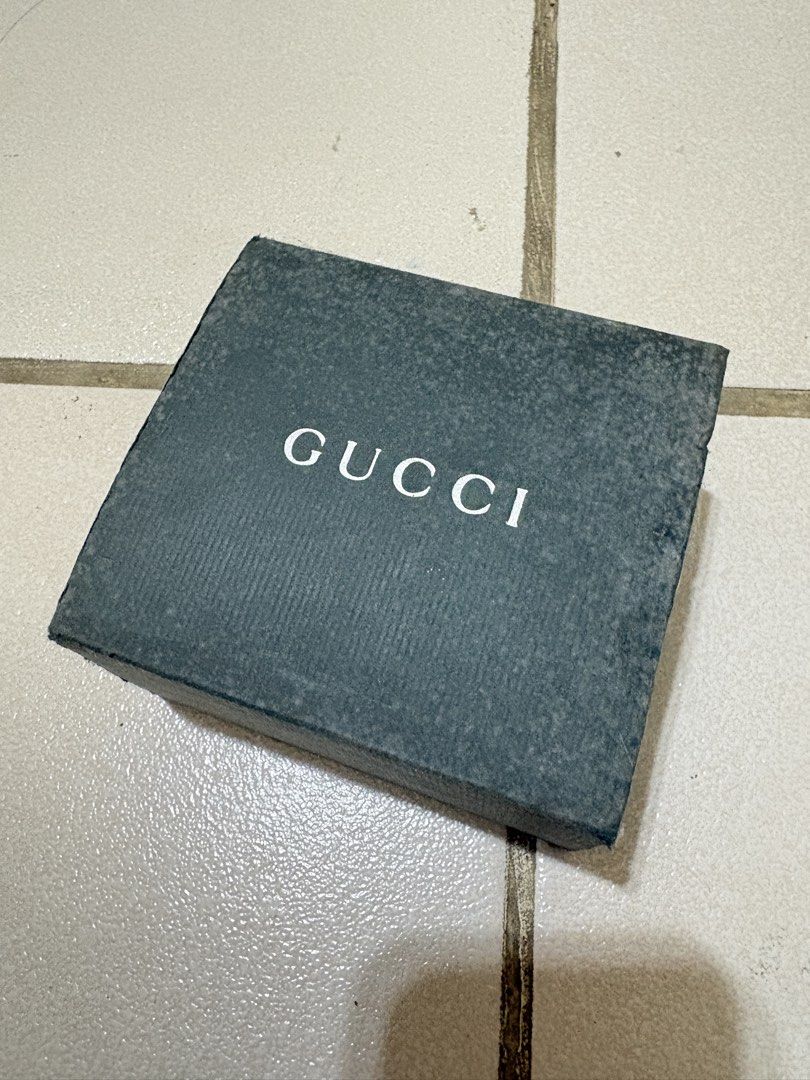 Gucci 1500L watch silver black dial (Category: Luxury Watches) located in Calamba. Submitted by angelliramosss (Listing ID 1467327288, Image 2). Description: - 100% Authentic Gucci rectangular watch - Chic minimalist design with a sleek black face/dial - Elegant silver-tone bangle strap - Includes original dark green Gucci box, interior branding, and watch pillow - Perfect accessory for daily wear or formal occasions Bought in Japan.