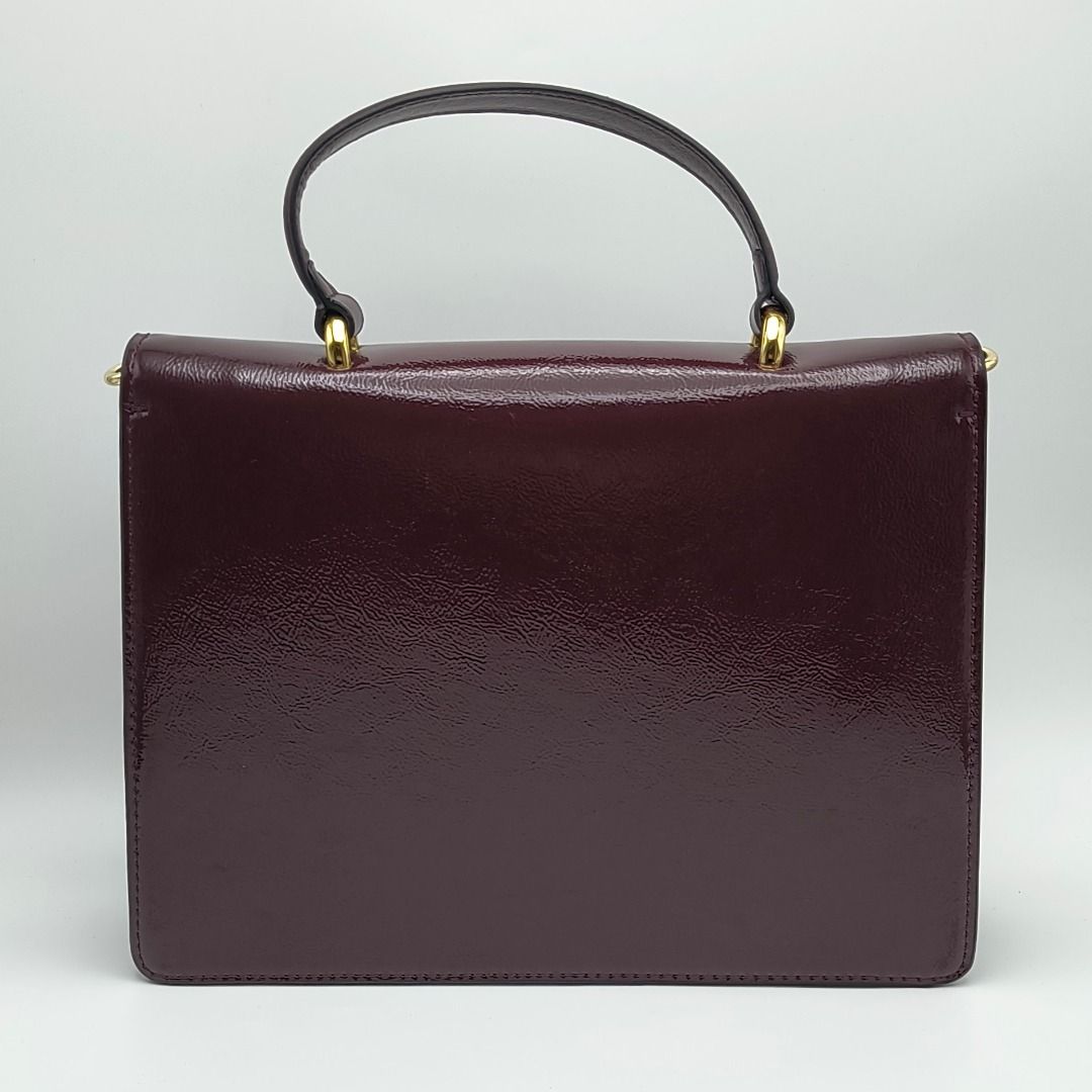 Gucci Dionysus Small Bag Burgundy (Category: Luxury Bags & Wallets) located in Cebu City. Submitted by affordabagss (Listing ID 1467216705, Image 2). Description: Gucci Dionysus Small Top Handle Bag in Rosso Ancora, crafted from glossy crinkled patent leather in a rich burgundy shade. Features the signature textured gold-tone tiger head closure, structured silhouette, top handle, and detachable adjustable leather shoulder strap for versatile styl