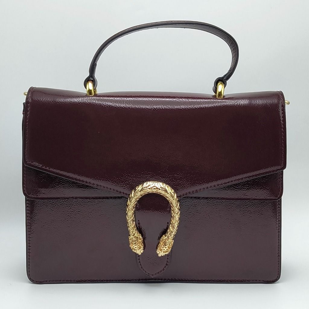Gucci Dionysus Small Bag Burgundy (Category: Luxury Bags & Wallets) located in Cebu City. Submitted by affordabagss (Listing ID 1467216705, Image 1). Description: Gucci Dionysus Small Top Handle Bag in Rosso Ancora, crafted from glossy crinkled patent leather in a rich burgundy shade. Features the signature textured gold-tone tiger head closure, structured silhouette, top handle, and detachable adjustable leather shoulder strap for versatile styl