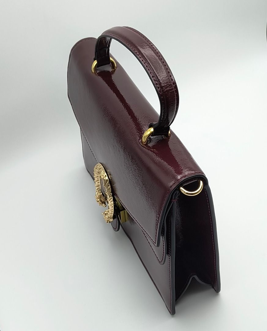 Gucci Dionysus Small Bag Burgundy (Category: Luxury Bags & Wallets) located in Cebu City. Submitted by affordabagss (Listing ID 1467216705, Image 3). Description: Gucci Dionysus Small Top Handle Bag in Rosso Ancora, crafted from glossy crinkled patent leather in a rich burgundy shade. Features the signature textured gold-tone tiger head closure, structured silhouette, top handle, and detachable adjustable leather shoulder strap for versatile styl
