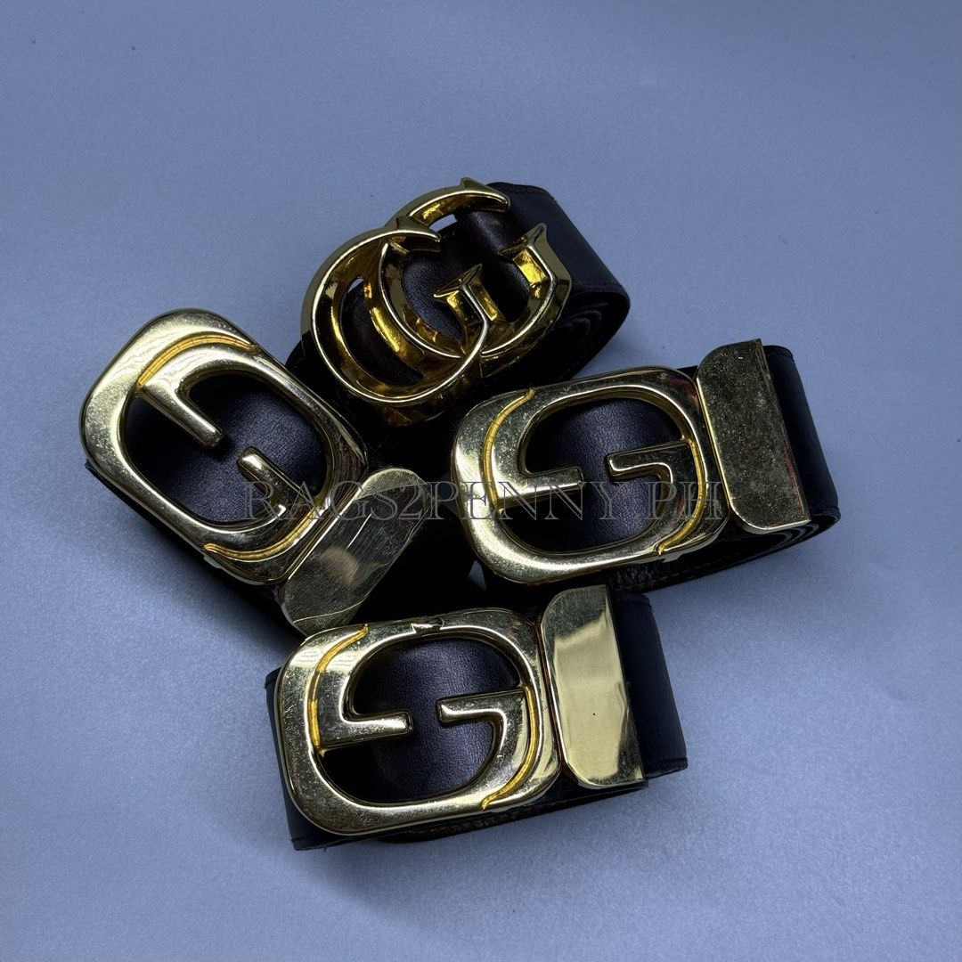 Gucci G-Buckle Leather Belts (Category: Luxury Accessories) located in Kabacan. Submitted by rags2penny.phl (Listing ID 1467225869, Image 2). Description: - Set of 4 authentic Gucci leather belts in classic black and dark brown - Genuine leather straps with premium visible grain texture - Gold-tone hardware featuring iconic interlocking G and single G buckles - Includes a variety of versatile buckle designs - Elevate any casual or formal outfit w