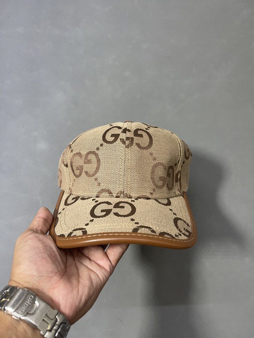 Gucci GG Canvas Baseball Cap Brown Beige (Category: Caps & Hats) located in Manila. Submitted by mine2ownit (Listing ID 1467287517, Image 2). Description: - Gucci baseball cap in classic brown and beige GG monogram canvas - Premium brown leather trim along the brim edge - Adjustable back strap with Gucci branding for a custom fit - Clean interior with branded lining ribbons and tags.