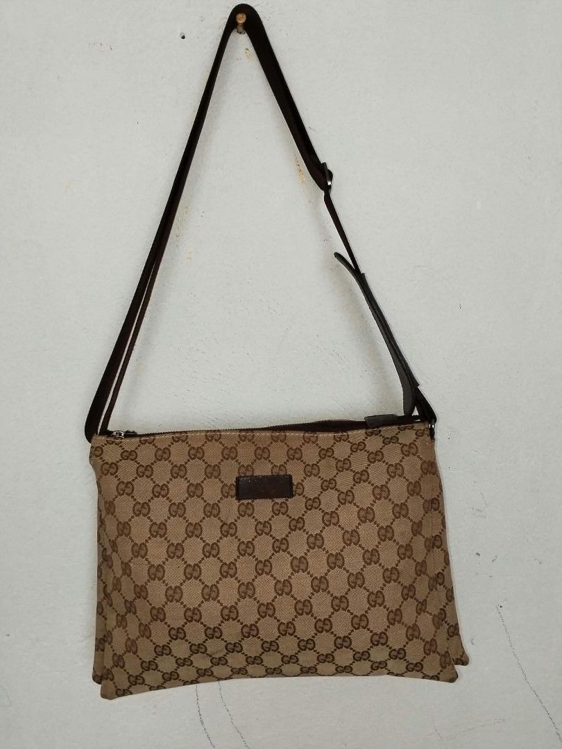 Gucci GG Monogram Crossbody Bag (Category: Luxury Bags & Wallets) located in Manila. Submitted by bagelyascollection (Listing ID 1467303641, Image 1). Description: - Authentic classic Gucci monogram crossbody bag in brown canvas - Brown leather strap and dark brown leather trim - Secure silver-tone hardware zip closure - Clean fabric-lined interior with stamped serial number tag (153010 00230) - Perfect everyday messenger size - Great overall sha