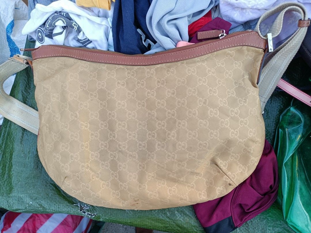 Gucci GG Nylon Half Moon (Category: Cross-body Bags) located in Bolinao. Submitted by shayne_0215 (Listing ID 1467340075, Image 3). Description: - Ukay Source - Has obvious signs of use - Coded - As Is Where Is - Last Price Posted - Deal Now, Pay Now - MOP: GCASH - SF will be shouldered by the buyer.