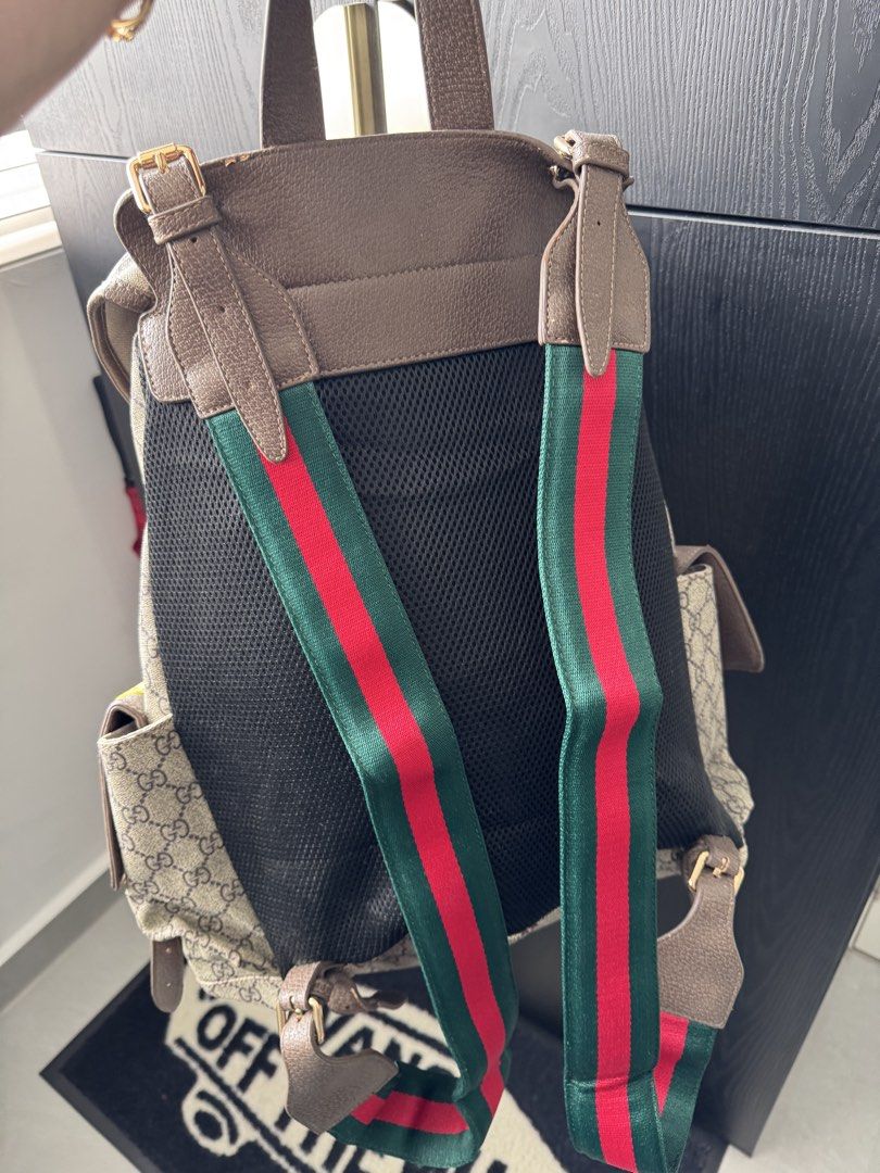 Canvas Patchwork Backpack (Category: Backpacks) located in Singapore. Submitted by rehomeedit (Listing ID 1467262238, Image 8). Description: - Backpack in iconic canvas - Features fun embroidered patches including a tiger, flowers, and Donald Duck - Brown leather trim and adjustable straps - Secure drawstring top closure with a buckle flap - Convenient side pockets with flap closures and snap buttons - Accented with the signature green and red We