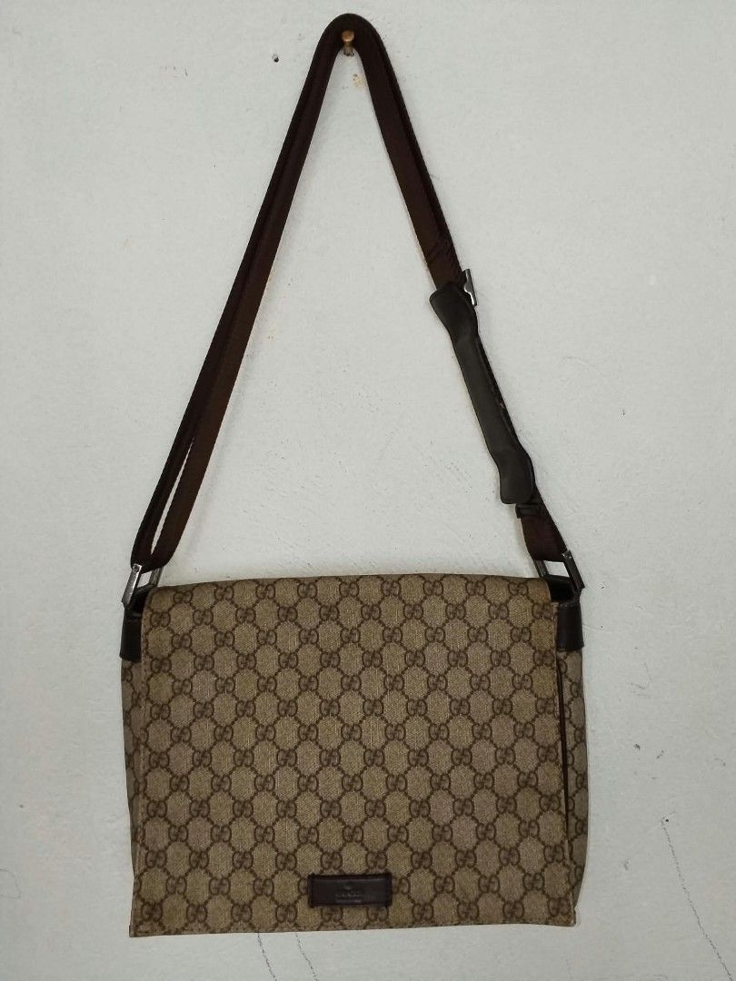 Gucci GG Supreme Messenger Bag (Category: Sling Bags) located in Manila. Submitted by bagelyascollection (Listing ID 1467303809, Image 1). Description: - Authentic Classic Gucci Messenger Bag - Iconic GG monogram canvas with brown leather trim - Adjustable canvas shoulder strap for comfortable wear - Secure flap closure with magnetic snap - Interior fabric lining with a convenient zipper pocket - Serial number stamped inside: 146236 9643 - Versat