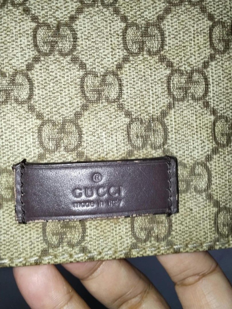 Gucci GG Supreme Messenger Bag (Category: Sling Bags) located in Manila. Submitted by bagelyascollection (Listing ID 1467303809, Image 3). Description: - Authentic Classic Gucci Messenger Bag - Iconic GG monogram canvas with brown leather trim - Adjustable canvas shoulder strap for comfortable wear - Secure flap closure with magnetic snap - Interior fabric lining with a convenient zipper pocket - Serial number stamped inside: 146236 9643 - Versat