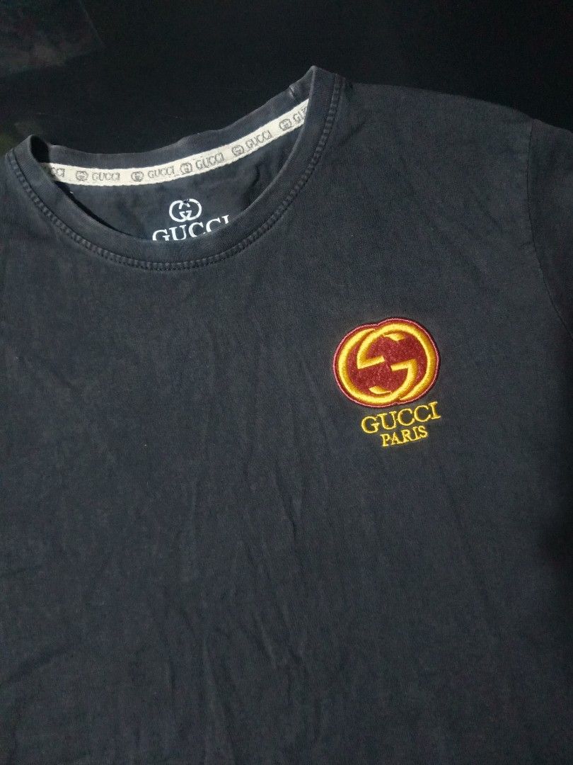 Gucci Paris Black T-Shirt (Category: Tshirts & Polo Shirts ) located in Bacoor. Submitted by knncze (Listing ID 1467208878, Image 1). Description: • preloved, wore it a lot • size tag: M • W×L - 18×25.5 • issue - one hole, worn out label.