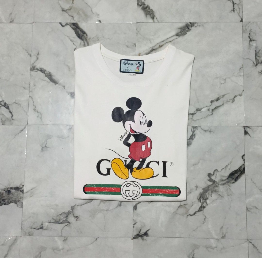 Gucci X Mickey Mouse Tee (Category: Luxury Apparel) located in Bacolod City. Submitted by luxtrend.ph (Listing ID 1467187312, Image 3). Description: Gucci X Mickey Mouse Tee •Photos may vary due to lighting✨ •Unisex •Size: M - L for Men / L - XL for Women •Condition: Like new •Issues: None •Color Rate: 9.9/10 •Complete tags •₱rice: 1,880 shipped🏷 DM to purchase🛒🛒🛒 Courier: J&T Express MOP: Gcash / Bank Transfer PAYMENT FIRST (NO COD) NO RETUR