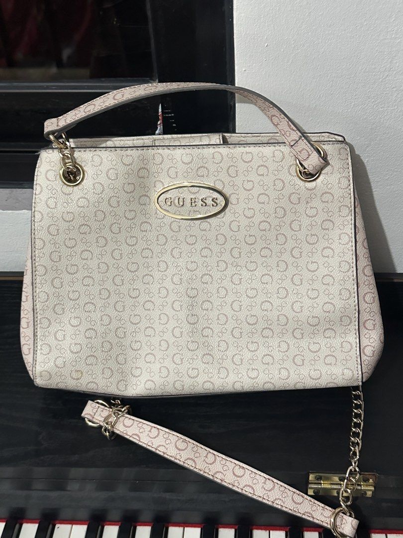 Guess Monogram Shoulder Bag with Chain Strap (Category: Shoulder Bags) located in Marikina City. Submitted by cheszam (Listing ID 1467203094, Image 2). Description: - Brand: Guess - Color: Off-white with monogram print - Hardware: Gold-tone - Strap: Chain strap included - Closure: Magnetic snap top closure - Interior: Multiple compartments, slip pockets, and a middle zip pocket with matching monogram lining - Branding: Metal Guess logo plaque on 