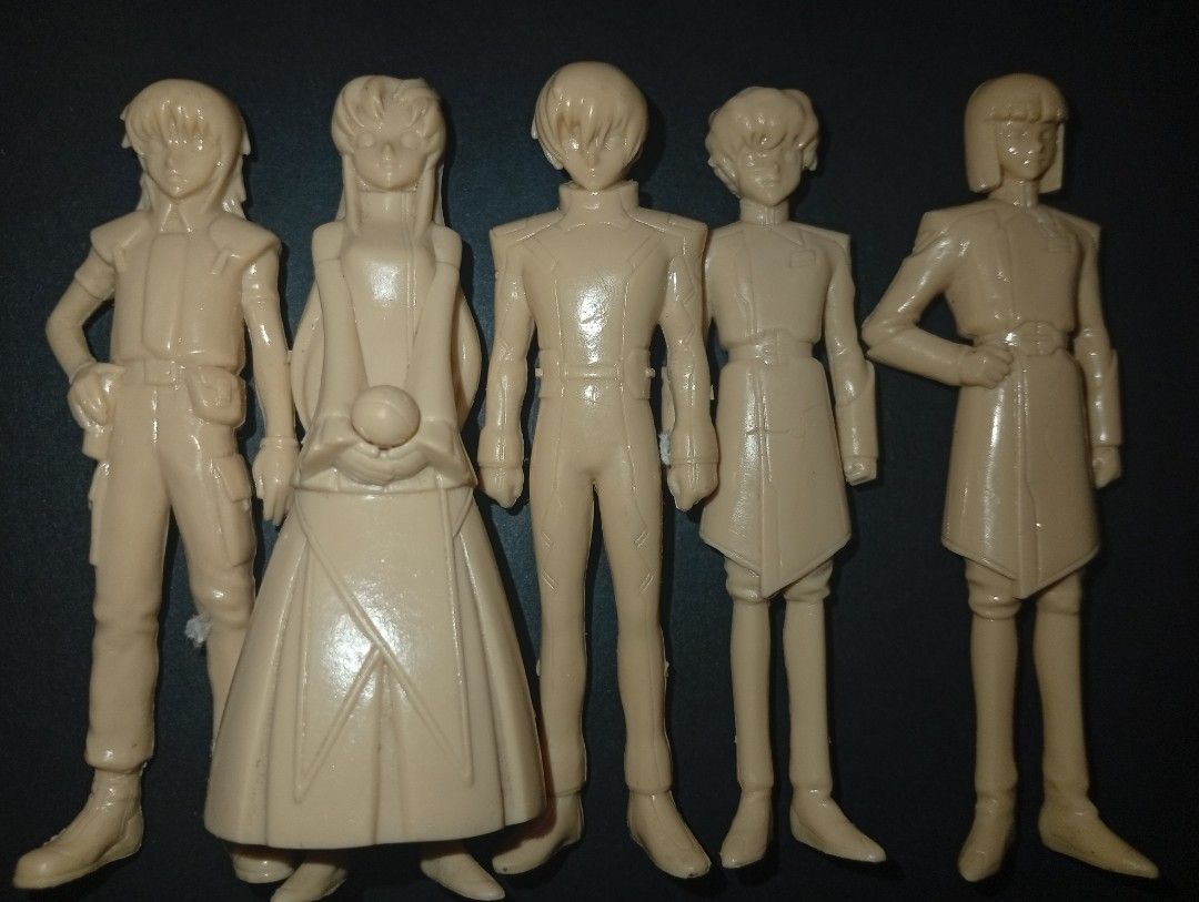 Gundam model kits pilot figures set/bundle (Category: Action & Battle Toys) located in Tarlac. Submitted by kio-kun (Listing ID 1467179660, Image 2). Description: Authentic 1/20 Scale Unpainted Character Figures (bundled inside vintage 1/100 scale model kits) Tan unpainted plastic figures are the 1/20 scale character figures Master Grade (MG) or High Grade (HG) Gundam model kits from the late 1990s and early 2000s. Like new Brand: Bandai 🔥 Origi
