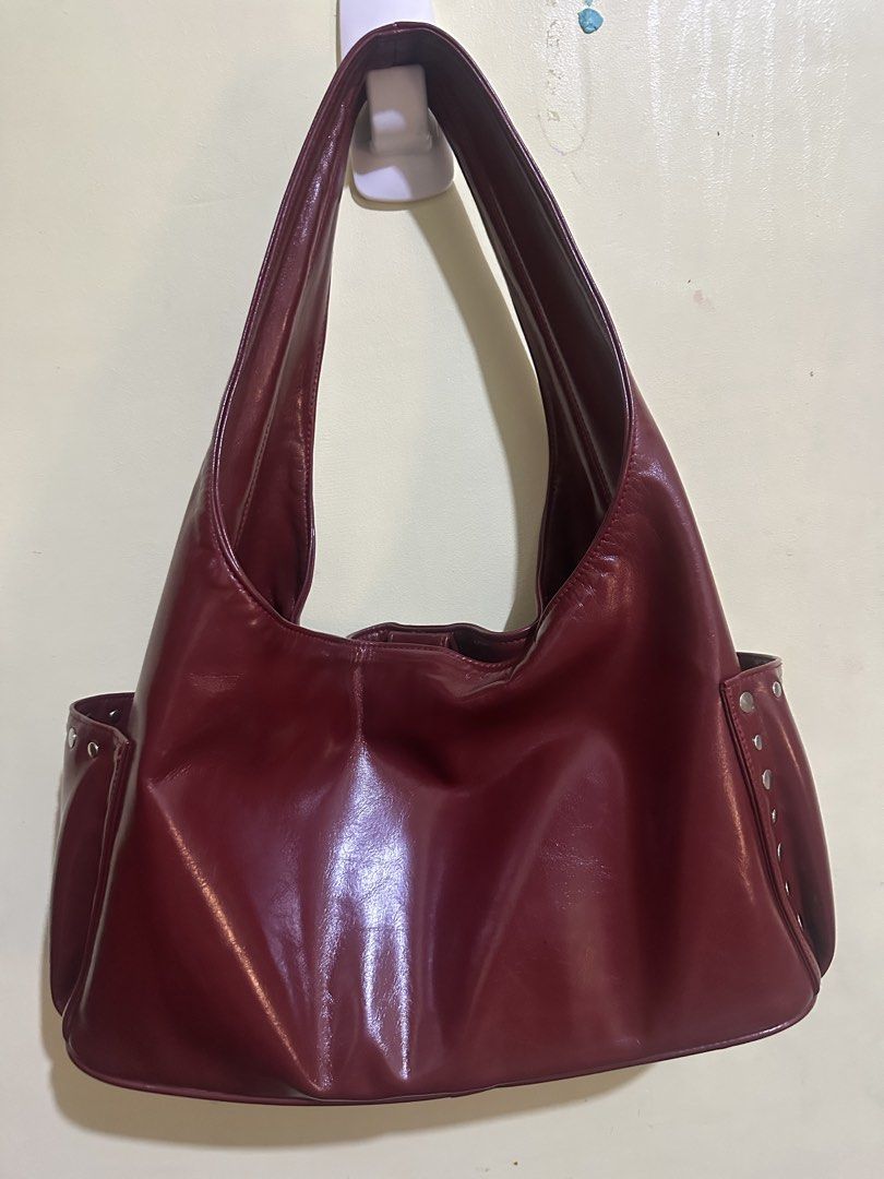 GVN studded hobo bag (Category: Shoulder Bags) located in Pasig City. Submitted by user6134 (Listing ID 1467289901, Image 2). Description: - can fit 13 inch laptop pero naka usli - can fit ipad - w/ organizer - pasig:mm.