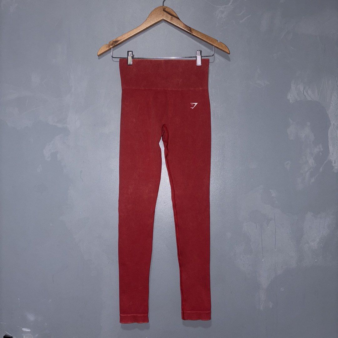 GYMSHARK GAINS SEAMLESS LEGGINGS (Category: Activewear) located in Lucena. Submitted by newacckeli (Listing ID 1467330396, Image 2). Description: worn onceeee - Brand: Gymshark - Size: S - Color/Finish: Red with trendy acid wash - Fit: High-waisted with flattering seamless contouring details in the back - Logo: White Gymshark sharkhead logo printed on the left hip - Material: Soft, stretchy, and comfortable fabric - Condition: Excellent (interior
