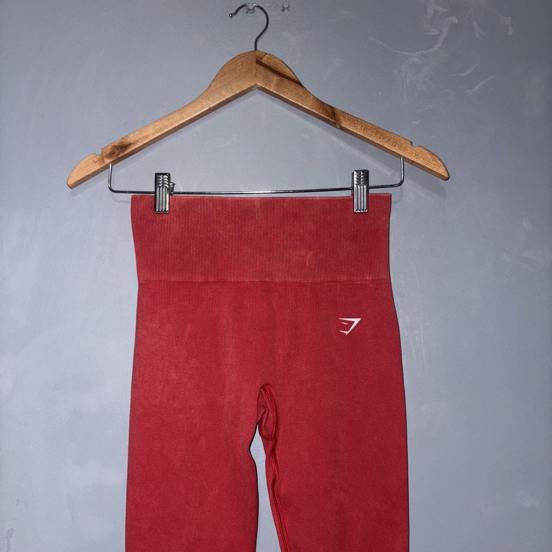 GYMSHARK GAINS SEAMLESS LEGGINGS (Category: Activewear) located in Lucena. Submitted by newacckeli (Listing ID 1467330396, Image 1). Description: worn onceeee - Brand: Gymshark - Size: S - Color/Finish: Red with trendy acid wash - Fit: High-waisted with flattering seamless contouring details in the back - Logo: White Gymshark sharkhead logo printed on the left hip - Material: Soft, stretchy, and comfortable fabric - Condition: Excellent (interior