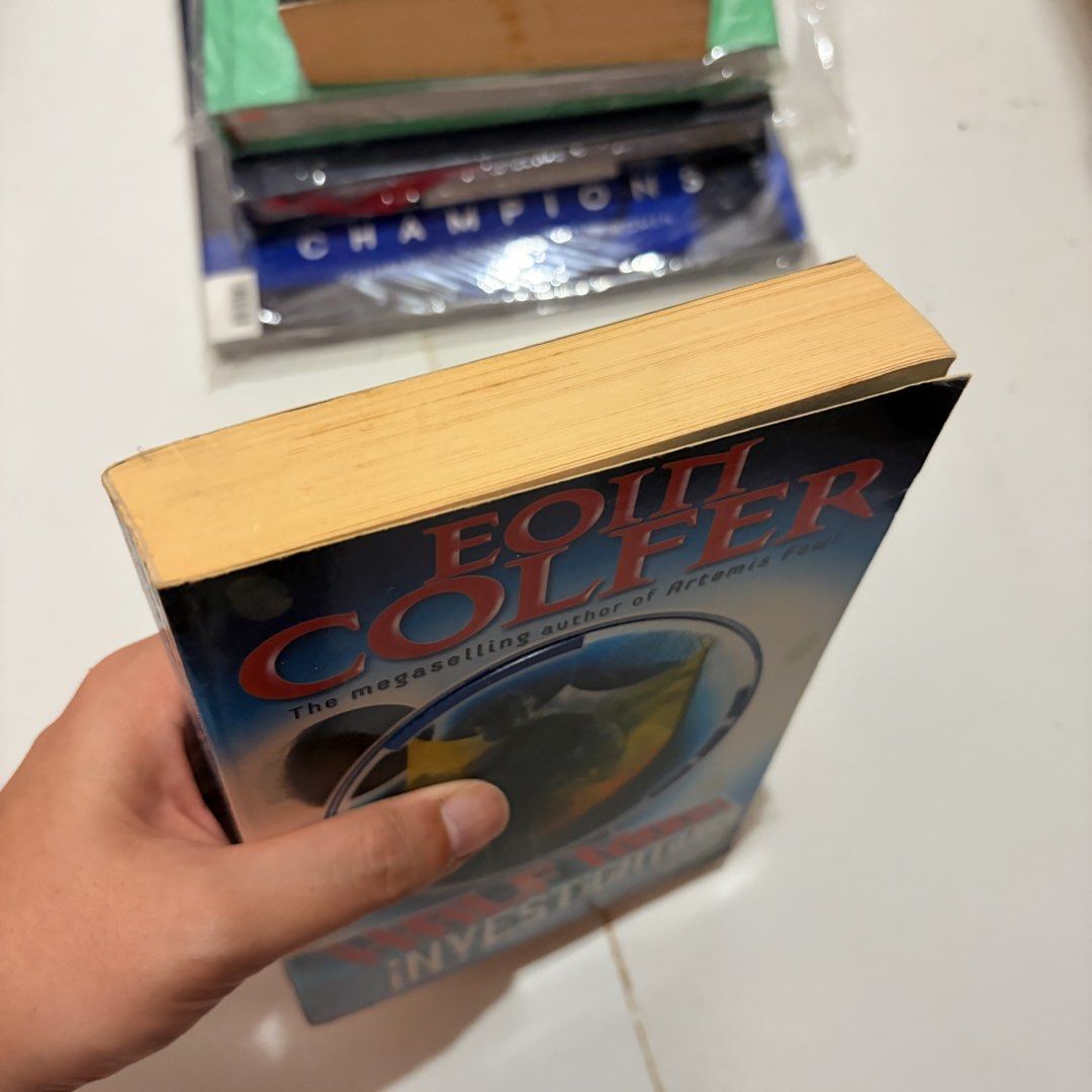 Half Moon Investigations by Eoin Colfer Paperback Book (Category: Storybooks) located in General Trias. Submitted by hayami.clo (Listing ID 1467289283, Image 3). Description: - Title: Half Moon Investigations - Author: Eoin Colfer (Creator of Artemis Fowl) - Publisher: Puffin - Format: Paperback - Condition: Standard shelf wear with yellowed pages - Synopsis: Follows Fletcher Moon, a pint-sized schoolboy and certified private investigator solving
