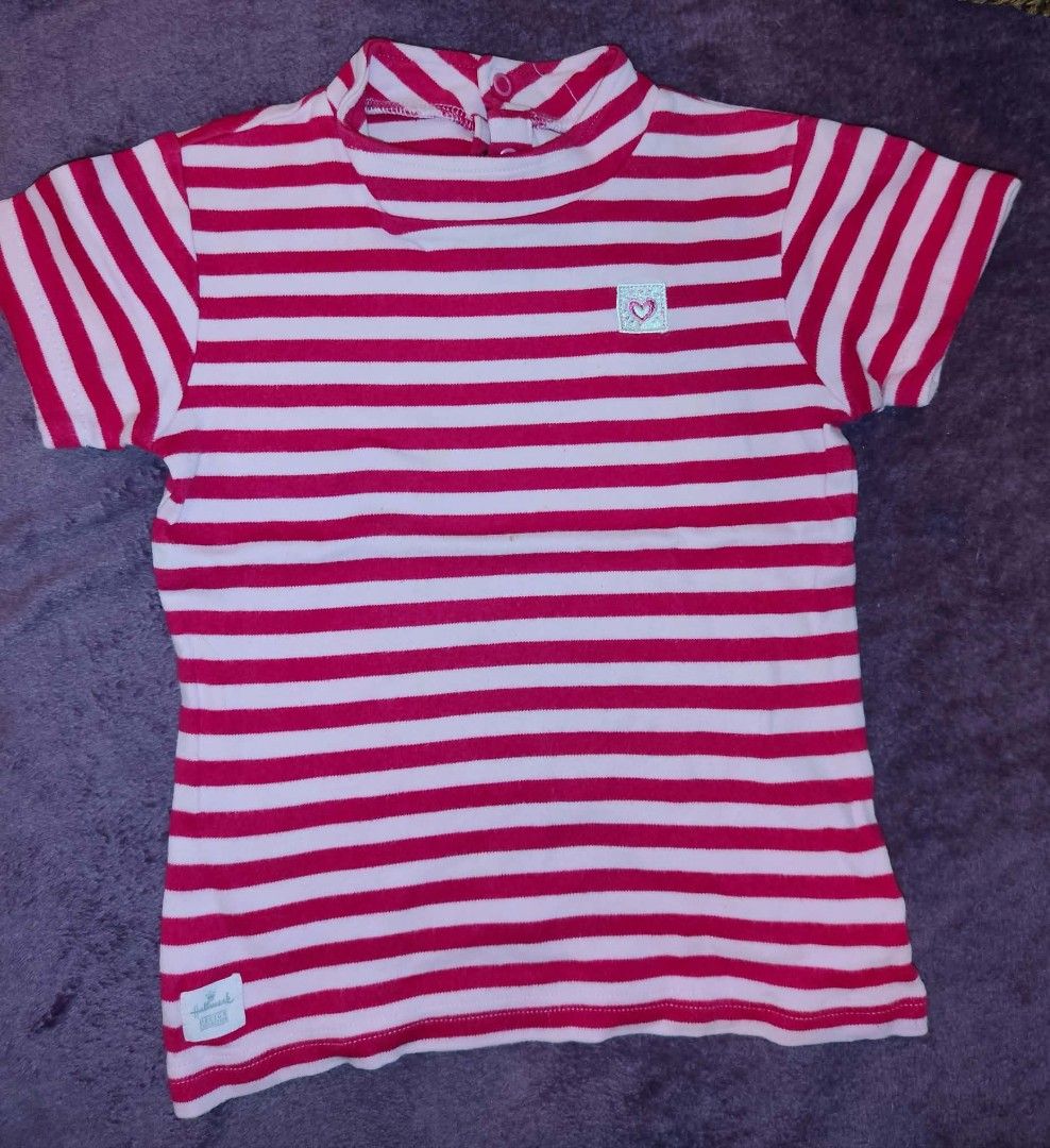 Hallmark kids shirt (Category: Tshirts & Polo Shirts ) located in Manila. Submitted by jilliese (Listing ID 1467191785, Image 1). Description: - Brand: Hallmark fit 2-4 like new - Design: Red and white stripes with small embroidered heart patch - Neckline: Mock neck with back button closure - Sleeves: Short sleeves - Material: Soft and comfortable cotton - Condition: Great everyday staple - Details: Includes Hallmark brand tag on bottom hem.