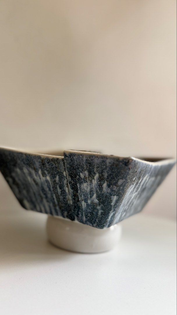 Handmade ceramic footed square bowl dark glaze (Category: Vases & Decorative Bowls) located in Baguio. Submitted by Mimii (Listing ID 1467228626, Image 2). Description: - Unique square ceramic bowl with a stable footed base - Dark speckled glaze on the inside with a glossy finish - Textured grey glaze on the outer sides - Heavy and durable pottery build - Ideal for serving or as a stylish home decor piece.