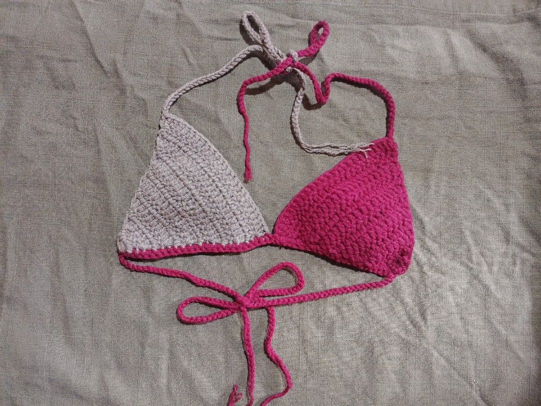 Handmade Crochet Two-Tone Bikini Top Pink Beige (Category: Bikinis & Swimsuits) located in Aroroy. Submitted by cloudspun (Listing ID 1467244775, Image 1). Description: - Handmade crochet bikini top - Two-tone design: beige left side, bright pink right side with matching trim - Adjustable tie strings at the neck and back for a custom fit - Soft and comfortable yarn construction - Brand new, unworn condition.