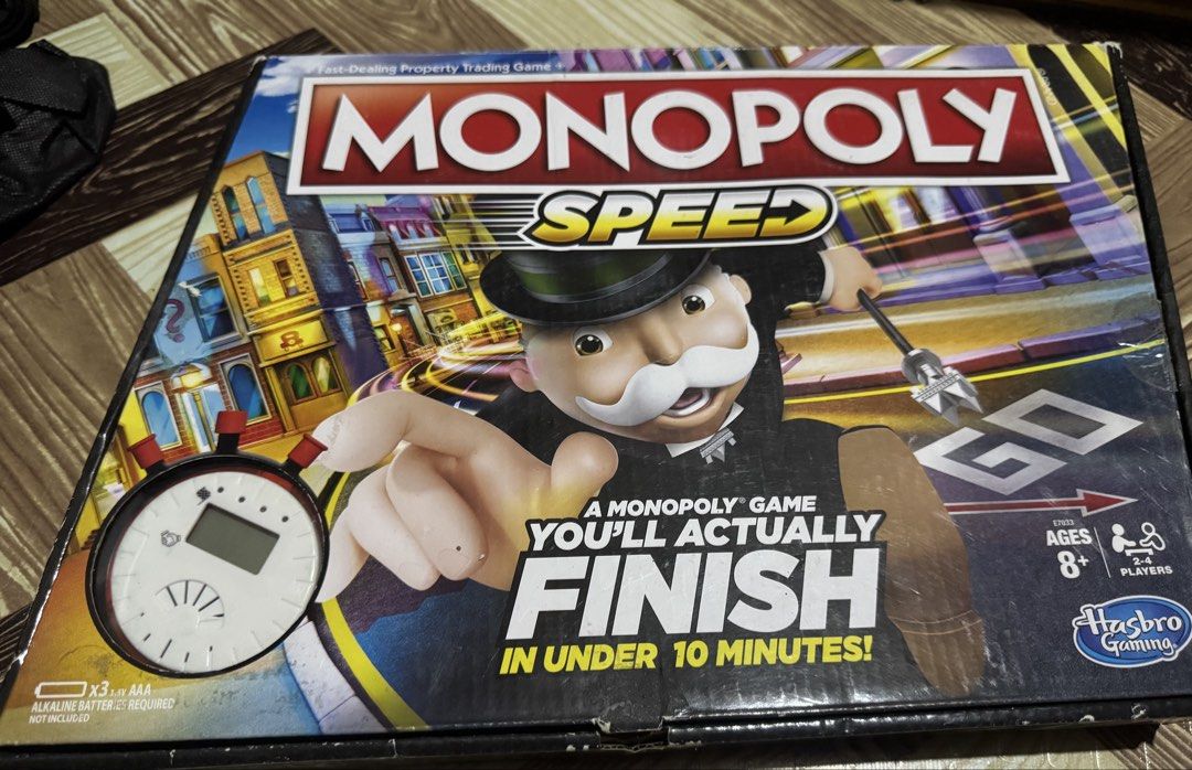 Hasbro Gaming Monopoly Speed Board Game E7033 (Category: Board Games & Puzzles) located in San Pedro. Submitted by pageturner19 (Listing ID 1467176843, Image 1). Description: - Game: Monopoly Speed fast-dealing property trading game - Playtime: Complete a full game in under 10 minutes - Players: For 2 to 4 players, ages 8 and up - Inclusions: Electronic timer, 4 plastic tokens, 28 title deed cards, 16 chance cards, 12 community chest cards, 4 dic