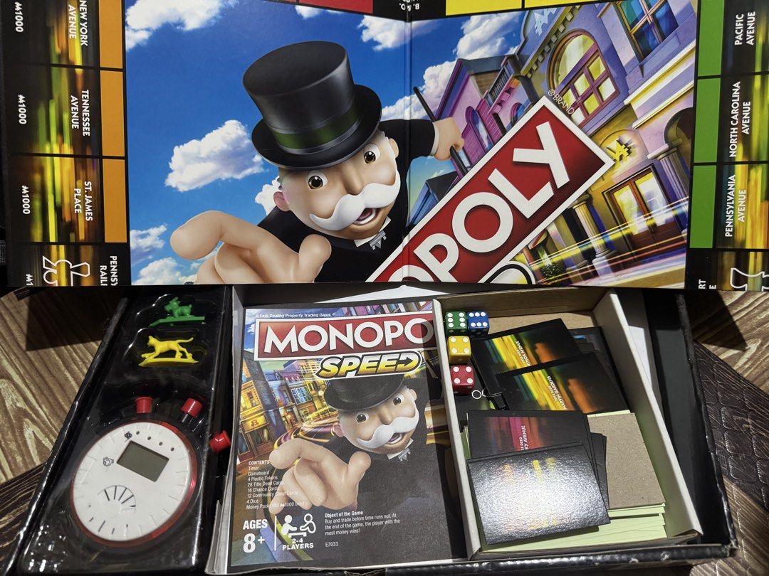 Hasbro Gaming Monopoly Speed Board Game E7033 (Category: Board Games & Puzzles) located in San Pedro. Submitted by pageturner19 (Listing ID 1467176843, Image 2). Description: - Game: Monopoly Speed fast-dealing property trading game - Playtime: Complete a full game in under 10 minutes - Players: For 2 to 4 players, ages 8 and up - Inclusions: Electronic timer, 4 plastic tokens, 28 title deed cards, 16 chance cards, 12 community chest cards, 4 dic