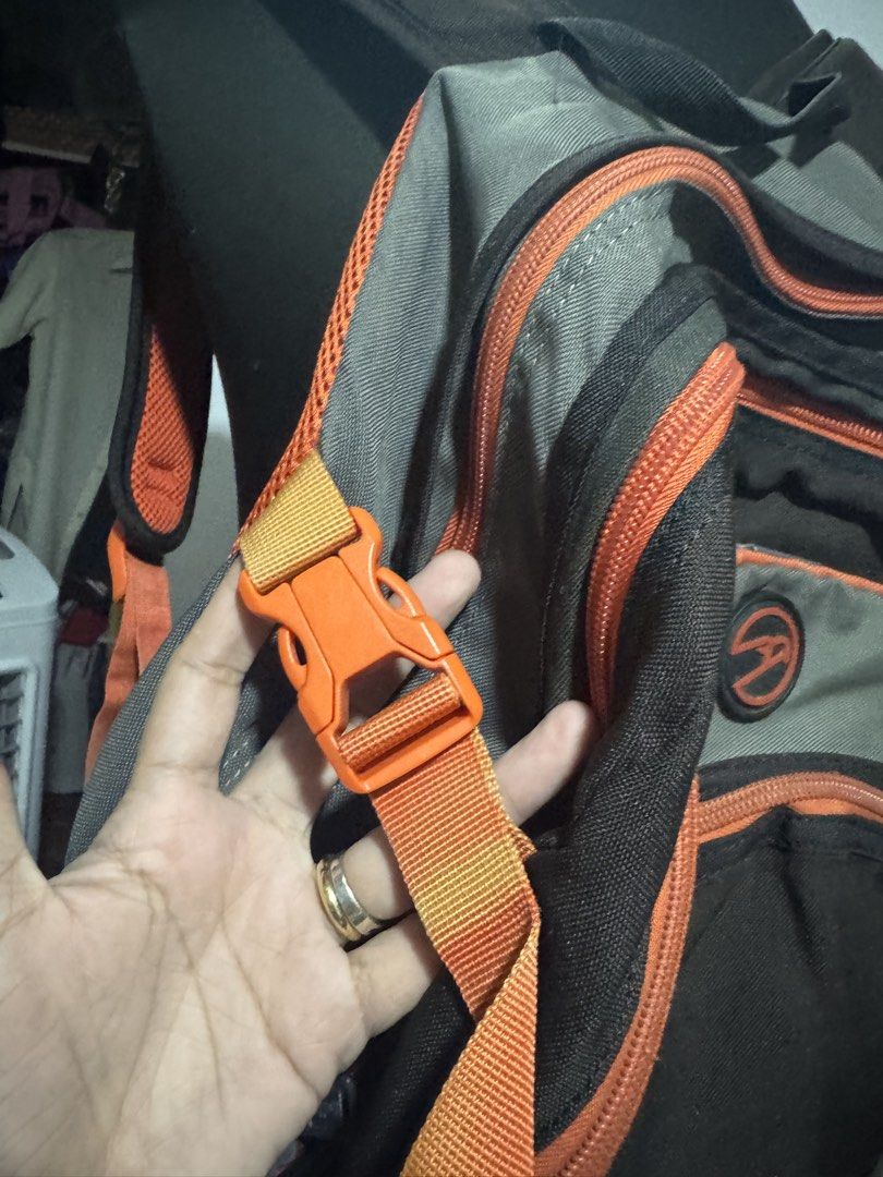Hawk backpack grey orange multi-compartment travel school bag (Category: Backpacks) located in Manila. Submitted by sheinevida (Listing ID 1467269639, Image 2). Description: discoloration hence selling cheap - Brand: Hawk - Colorway: Grey and orange - Exterior: Multiple zipped front compartments and secure side buckle straps - Interior: Built-in organizers, key hook clip, and mesh pockets - Condition Notes: Sturdy, fully functioning zippers and a