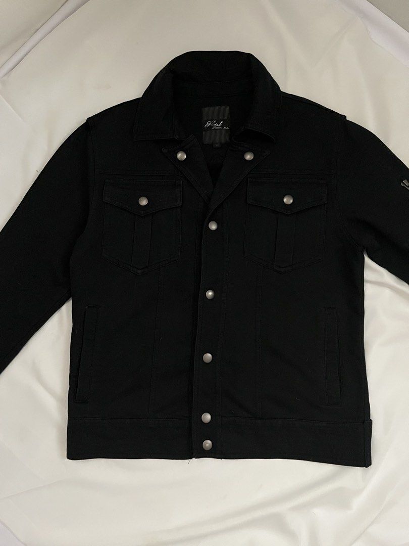 Heist Premium Label Black Jacket (Category: Coats, Jackets and Outerwear) located in Paranaque City. Submitted by laichii00 (Listing ID 1467348568, Image 1). Description: - Brand: Heist Premium Label - Color: Black - Closure: Front button with metallic snap buttons - Pockets: Dual chest flap pockets, side slip pockets, and a zipped left sleeve utility pocket.