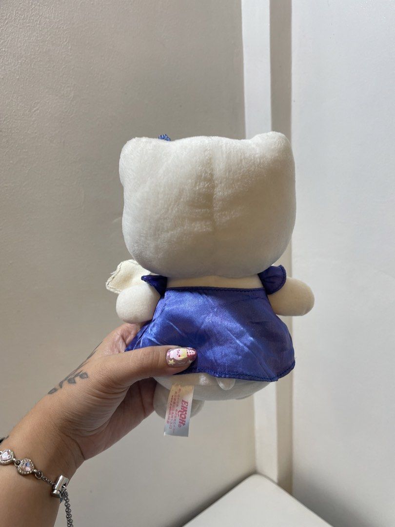 Hello Kitty Eikoh Magical Star Blue Dress Plush (Category: Plushies & Soft Toys) located in Iba. Submitted by wealtheallymari99 (Listing ID 1467268572, Image 3). Description: - Authentic Eikoh Kitty plush doll, direct from Japan - Dressed in a shiny blue satin gown with floral bead neckline accents - Matching star headpiece with a blue gem and a cute fabric star wand in hand - Soft white plush body featuring neat black embroidered eyes and whiske