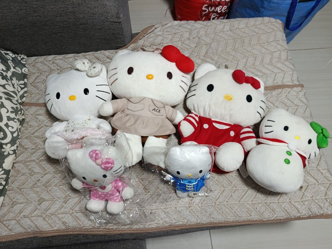Hello Kitty Plush Toys Bundle (Category: Plushies & Soft Toys) located in Quezon City. Submitted by robelles_thriftshop (Listing ID 1467293628, Image 1). Description: - Bundle of Kitty plush toys in various sizes and adorable outfits - Includes special editions: brown dress with ACE tag, red striped shirt, and snowman style with green bow - Comes with two smaller plushies still in original plastic packaging - Made with ultra-soft, high-quality ma