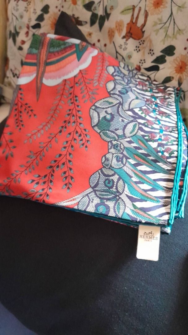 Hermes Silk Scarf Orange Green Pattern (Category: Scarves) located in Caloocan City. Submitted by mariel14_wolf (Listing ID 1467308230, Image 1). Description: - Authentic Hermes silk scarf - Vibrant orange and green floral pattern - Luxurious soft silk material with hand-rolled edges - Original care tag attached - Perfect versatile accessory to dress up any outfit - Condition: Excellent.