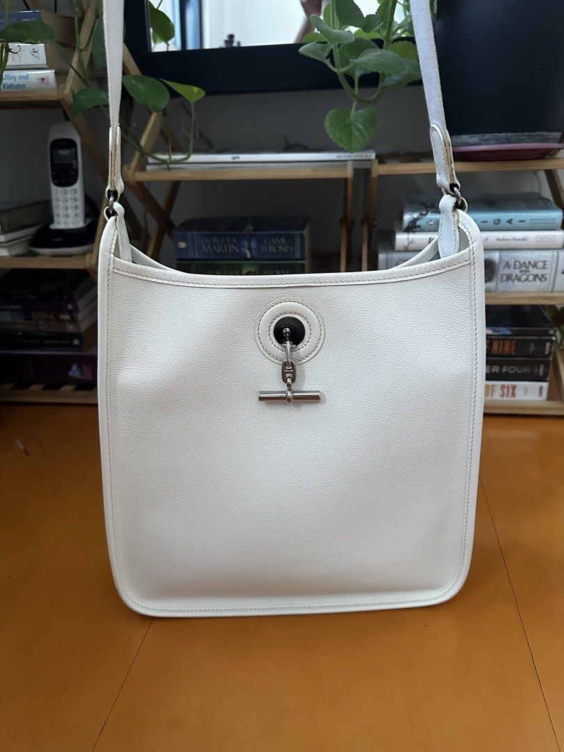 Hermes Vespa PM Epsom White (Category: Luxury Bags & Wallets) located in Angeles City. Submitted by luxenstuff (Listing ID 1467311071, Image 1). Description: Hermes Vespa Epsom Leather White Square G (2003) Lightly used With some glue marks on the strap joints but overall excellent condition 28cm x 28cm x 7-7.5cm Palladium Hardware Strap: 86-90cm (roughly 45cm shoulder drop) Collector’s item as the model has been discontinued (Guaranteed Authenti
