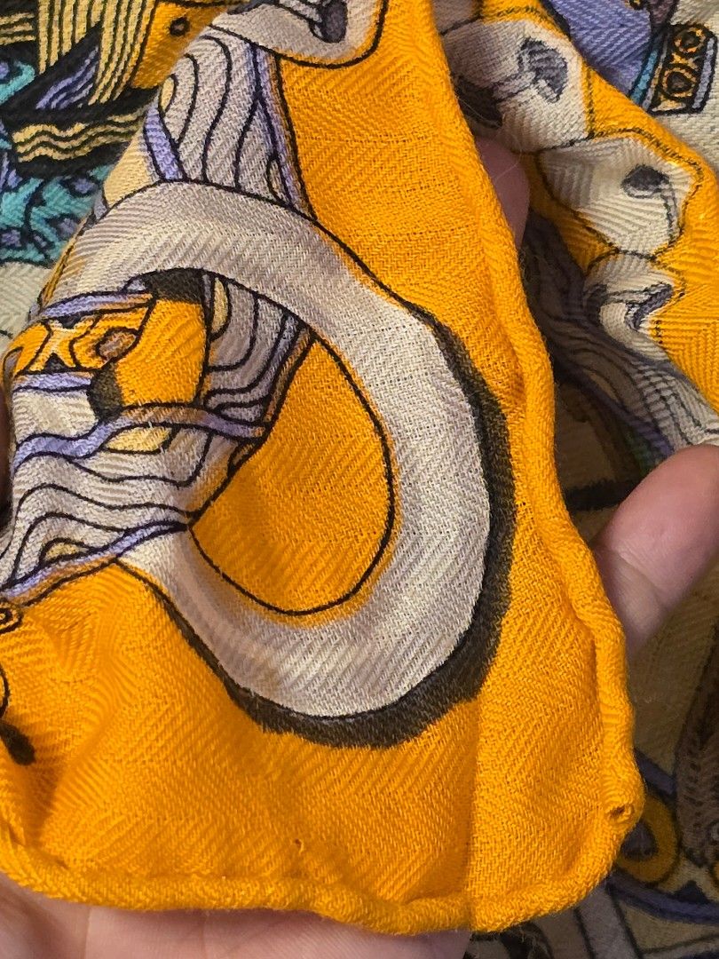 Hermès, cashmere 'Dame de Coeur' (Category: Scarves) located in Baguio. Submitted by sonny14 (Listing ID 1467352951, Image 3). Description: Hermès, a cashmere 'Dame de Coeur' shawl. Design Pierre Marie. 120 x 120 cm. - Brand: Hermès - Color: Bright yellow with vibrant blue, purple, and black multi-color details - Design: Detailed playing card illustration featuring animal figures and French text 'Dame de Coeur à vous l'honneur' - Finishing: Hand-