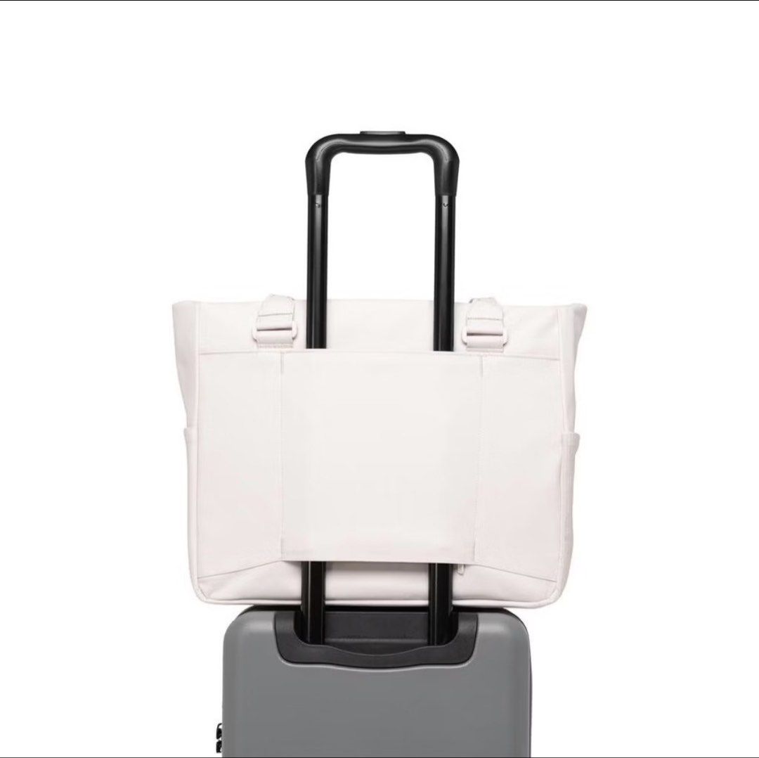 Herschel Kaslo Tech Tote/Shoulder Bag (Category: Tote Bags) located in Imus. Submitted by misskayyy (Listing ID 1467357529, Image 2). Description: - Authentic Herschel Kaslo tech tote and shoulder bag - Sleek neutral light grey/off-white shade - Front zippered pocket with built-in organizer sleeve - Comfortable dual top carry handles - Convenient rear luggage trolley sleeve for easy travel - Side slip pocket for quick-access items - Clean minimal