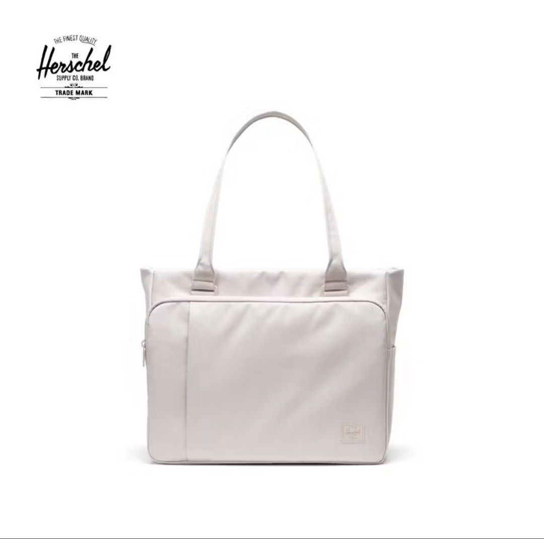 Herschel Kaslo Tech Tote/Shoulder Bag (Category: Tote Bags) located in Imus. Submitted by misskayyy (Listing ID 1467357529, Image 1). Description: - Authentic Herschel Kaslo tech tote and shoulder bag - Sleek neutral light grey/off-white shade - Front zippered pocket with built-in organizer sleeve - Comfortable dual top carry handles - Convenient rear luggage trolley sleeve for easy travel - Side slip pocket for quick-access items - Clean minimal