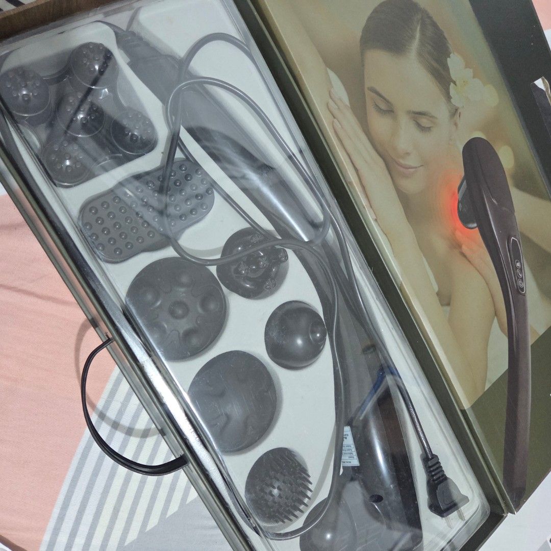 Hiroshi Healing Touch Therapy Massager HTT-2022v2 (Category: Massage Devices) located in Caloocan City. Submitted by zenwater.e03294 (Listing ID 1467188352, Image 3). Description: - Model: Hiroshi Healing Touch Therapy HTT-2022v2 - Function: Deep tissue massage for muscle tension and fatigue relief - Design: Long handle for easy reach on the back and hard-to-reach spots - Settings: Multiple vibration modes and adjustable intensity levels - Attach