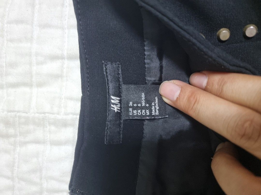 H&M Black Studded Mini Skirt (Category: Skirts) located in Narvacan. Submitted by 2ndchancefinder (Listing ID 1467297505, Image 2). Description: - Brand: H&M - Color: Black with metal studs on sides and front - Style: High-waisted mini skirt, structured fabric - Size: US 6 / EUR 36 - Closure: Back zipper - Condition: Excellent / Pre-loved (ready to wear) - Origin: Made in Bangladesh Can be bundled with the other skirts, 2 for 180, 3 for 240 and 4