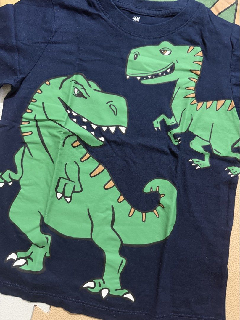 H&M Dinosaur T-Shirts Bundle (Category: Babies & Kids Fashion) located in Pasig City. Submitted by cjmo_ (Listing ID 1467271180, Image 2). Description: - Set of 3 H&M short sleeve dinosaur t-shirts for boys - Size: EUR 110/116 | US 5T/6 | UK 4-6Y - Condition: Great bundle deal for little dino fans Used 1-2 times only.