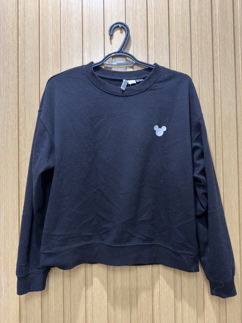 H&M Divided Disney Mickey Mouse Black Sweatshirt (Category: Coats, Jackets and Outerwear) located in Bacoor. Submitted by preloved_with_love_ (Listing ID 1467335025, Image 1). Description: - Brand: H&M Divided x Disney - Color: Black - Design: Minimalist white Mickey Mouse ear silhouette embroidered on the left chest - Material: 50% cotton, 50% polyester blend - Details: Ribbed collar, cuffs, and hem - Size: EUR L, UK L, CN 165/104A - Measurement